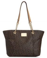Standout in signature style with this take-anywhere tote from Calvin Klein, featuring the iconic CK monogram. Soft leather trim, gleaming hardware and spacious interior make this silhouette an every season essential. Standout in signature style with this take-anywhere tote from Calvin Klein, featuring the iconic CK monogram. Soft leather trim, gleaming hardware and spacious interior make this silhouette an every season essential.