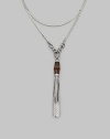 A bamboo bead and sterling silver tassels drop elegantly from a modern, snake-inspired chain with horsebit details. Bamboo Sterling silver Length around neck, about 43 Made in Italy