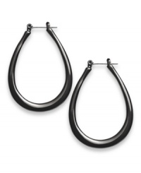 Distinctively designed. Style&co.'s traditional hoop earrings get a modern makeover thanks to their teardrop silhouette. Set in black enamel over silver tone mixed metal, they're sure to stand out as a fashionable favorite in your jewelry collection. Approximate diameter: 1-1/4 inches. Distinctively designed. Style&co.'s traditional hoop earrings get a modern makeover thanks to their teardrop silhouette. Set in black enamel over silver tone mixed metal, they're sure to stand out as a fashionable favorite in your jewelry collection. Approximate diameter: 1-1/4 inches.