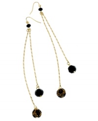 Dust your shoulders! Fiercely bold and beaded, GUESS's double drop earrings feature shiny black and leopard-printed glass beads. Set in gold tone mixed metal. Approximate drop: 5-1/4 inches. Dust your shoulders! Fiercely bold and beaded, GUESS's double drop earrings feature shiny black and leopard-printed glass beads. Set in gold tone mixed metal. Approximate drop: 5-1/4 inches.