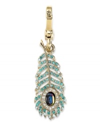 Walk proud with this peacock feather-styled charm from Juicy Couture. Crafted from gold tone brass with glistening glass accents and round cubic zirconia (1 ct. t.w.), the charm offers a whimsical fashion approach. Approximate drop: 2 inches. Walk proud with this peacock feather-styled charm from Juicy Couture. Crafted from gold tone brass with glistening glass accents and round cubic zirconia (1 ct. t.w.), the charm offers a whimsical fashion approach. Approximate drop: 2 inches.