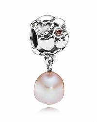 A rose-colored pearl dangles gently from a sterling silver PANDORA charm featuring heart motifs and pink cubic zirconia. A rose-colored pearl dangles gently from a sterling silver PANDORA charm featuring heart motifs and pink cubic zirconia.