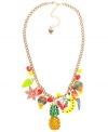 Tropical fruity charms. Betsey Johnson's antique gold tone mixed metal necklace features the most delicious charms: red cherries, yellow banana, green grapes, a pineapple with green details and crystal accents, multi-colored striped beads, and yellow and red faceted beads. Approximate length: 16 inches + 3-inch extender. Approximate drop: 2-1/4 inches.