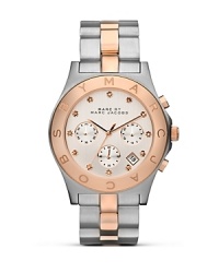 MARC BY MARC JACOBS makes a metallic statement with this dual tone watch. Crated of plated stainless steel with rose gold glitz accents, it's a super striking choice. MARC BY MARC JACOBS makes a metallic statement with this dual tone watch. Crated of plated stainless steel with rose gold glitz accents, it's a super striking choice.