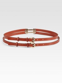 Slender leather straps, connected with hardware in the back and fastened with dual metal buckles.About ½ wideLeatherMade in Italy of imported fabric Slender leather straps, connected with hardware in the back and fastened with dual metal buckles.About ½ wideLeatherMade in Italy of imported fabric