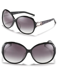 Turn heads in these oversized round sunglasses with open metal temples and reptile print along arms. Turn heads in these oversized round sunglasses with open metal temples and reptile print along arms.