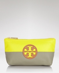 Tory Burch pops and blocks it with this top zip cosmetics case, accented by a bold logo and contrasting neon and neutral hues. It's a bold way to bag your beauty products. Tory Burch pops and blocks it with this top zip cosmetics case, accented by a bold logo and contrasting neon and neutral hues. It's a bold way to bag your beauty products.