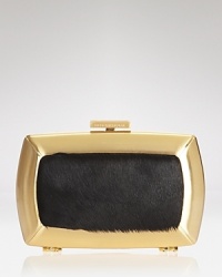 The party-perfect clutch from BCBGMAXAZRIA has a wild-child quality about it. The party-perfect clutch from BCBGMAXAZRIA has a wild-child quality about it.