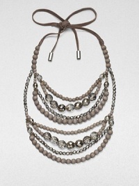 Multiple strands of faceted glass and wooden beads, suspended from a supple suede tie.Glass and wood beadsMetal-tipped suede tie closureDrop, about 14Made in Italy Multiple strands of faceted glass and wooden beads, suspended from a supple suede tie.Glass and wood beadsMetal-tipped suede tie closureDrop, about 14Made in Italy