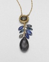 From the Elements Siyabona Collection. One bold faceted teardrop and a cluster of tiny faceted leaves hang from a deeply colored oval framed in Swarovski crystals, all on a graceful golden chain.CrystalLabradorite, blue kynite and pyriteGoldtoneLength, about 16 with 3 extenderLobster claspMade in USA
