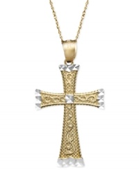 A versatile two tone cross pendant in design to last a lifetime. Crafted in 14k gold and 14k white gold, cross features an engraved scroll pattern and diamond-cut accents. Approximate length: 18 inches. Approximate drop width: 1 inch. Approximate drop length: 1-1/2 inches.