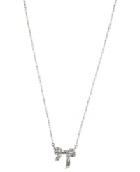 Glistening shine, by Anne Klein. The prettiest finishing touch, this pendant necklace from Anne Klein strings a pave crystal-accented bow on a silver-tone chain. Crafted in silver tone mixed metal. Approximate length: 16 inches + 2-inch extender. Approximate drop: 1/2 inch. Glistening shine, by Anne Klein. The prettiest finishing touch, this pendant necklace from Anne Klein strings a pave crystal-accented bow on a silver-tone chain. Crafted in silver tone mixed metal. Approximate length: 16 inches + 2-inch extender. Approximate drop: 1/2 inch.