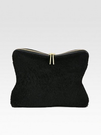 Luxurious shearling and leather design in a simple and elegant style, perfect for day to night.Convertible top handle strap, 1 dropTop zip closureOne inside zip pocketFully lined15W X 8H X 3½DImported Luxurious shearling and leather design in a simple and elegant style, perfect for day to night.Convertible top handle strap, 1 dropTop zip closureOne inside zip pocketFully lined15W X 8H X 3½DImported