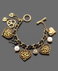 Accessorize with a little jungle love. This Betsey Johnson charm bracelet features leopard heart charms, crystal accents and imitation pearls set in goldtone mixed metal. Approximate length: 7 inches. Approximate charm drop: 1 inch. Accessorize with a little jungle love. This Betsey Johnson charm bracelet features leopard heart charms, crystal accents and imitation pearls set in goldtone mixed metal. Approximate length: 7 inches. Approximate charm drop: 1 inch.