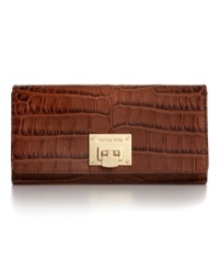Get organized in the most exotic way with this chic croc-embossed leather carryall from MICHAEL Michael Kors. Ideally sized to slip inside a handbag or carry as a clutch, it boasts plenty of pockets and compartments for cards, cash, coins, and more. Get organized in the most exotic way with this chic croc-embossed leather carryall from MICHAEL Michael Kors. Ideally sized to slip inside a handbag or carry as a clutch, it boasts plenty of pockets and compartments for cards, cash, coins, and more.