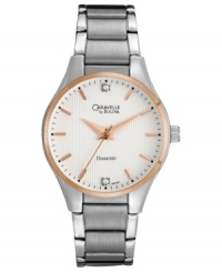 Two sparkling diamond accents blend with rosy tones on this modern watch from Caravelle by Bulova. Two sparkling diamond accents blend with rosy tones on this modern watch from Caravelle by Bulova.