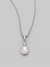 Simple and lovely, a white, round cultured Akoya pearl has a sparkling diamond accent, plus a chain and setting of 18k gold. 7mm white round cultured pearl Quality: A+ Diamond, 0.05 tcw 18k white gold Length, about 18 Spring ring clasp Imported Simple and lovely, a white, round cultured Akoya pearl has a sparkling diamond accent, plus a chain and setting of 18k gold. 7mm white round cultured pearl Quality: A+ Diamond, 0.05 tcw 18k white gold Length, about 18 Spring ring clasp Imported