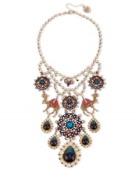 Get over the fashion hump. Betsey Johnson's fun bib necklace combines gold tone setting with crystal cup chain, glitter camel charms with multi-colored details and crystal accents, round medallions with flower and crystal accents, purple and blue teardrop with crystal accents. Set in antiqued gold tone mixed metal. Approximate length: 16 inches + 3-inch extender. Approximate drop: 6-1/2 inches. Get over the fashion hump. Betsey Johnson's fun bib necklace combines gold tone setting with crystal cup chain, glitter camel charms with multi-colored details and crystal accents, round medallions with flower and crystal accents, purple and blue teardrop with crystal accents. Set in antiqued gold tone mixed metal. Approximate length: 16 inches + 3-inch extender. Approximate drop: 6-1/2 inches.