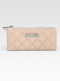 Luxurious leather in an elegant quilted design with a sleek logo plaque.Zip-around closureOne inside zip pocketEight credit card slotsTwo bill compartmentsFully lined7¾W X 3½H X ¾DMade in Italy Luxurious leather in an elegant quilted design with a sleek logo plaque.Zip-around closureOne inside zip pocketEight credit card slotsTwo bill compartmentsFully lined7¾W X 3½H X ¾DMade in Italy