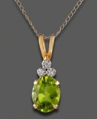 Set in sunny 14K yellow gold, August's gleaming birthstone, peridot, topped with sparkling diamond accents, is the star of this pendant design. Set in sunny 14K yellow gold, August's gleaming birthstone, peridot, topped with sparkling diamond accents, is the star of this pendant design.