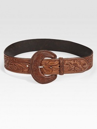 An oversized buckle and intricately designed leather give this belt rustic charm. About 2 wideLeatherImported An oversized buckle and intricately designed leather give this belt rustic charm. About 2 wideLeatherImported