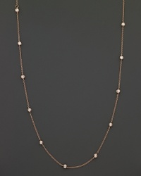 Diamond stations shine on a delicate rose gold necklace. Diamond stations shine on a delicate rose gold necklace.