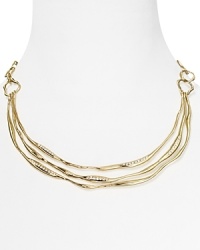 Curved metal is detailed with delicate cubic zirconia stones on this Nadri collar necklace, offering the illusion of liquid like movement. Curved metal is detailed with delicate cubic zirconia stones on this Nadri collar necklace, offering the illusion of liquid like movement.