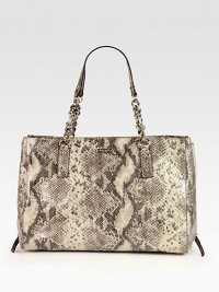 A roomy carryall in luxurious snake embossed leather with expandable side zippers.Double chain and snake embossed leather top handles, 8½ dropMagnetic snap tab closureProtective metal feetExpandable side zippersOne inside zip pocketTwo inside open pocketsCotton lining15W X 10H X 4½DImported A roomy carryall in luxurious snake embossed leather with expandable side zippers.Double chain and snake embossed leather top handles, 8½ dropMagnetic snap tab closureProtective metal feetExpandable side zippersOne inside zip pocketTwo inside open pocketsCotton lining15W X 10H X 4½DImported