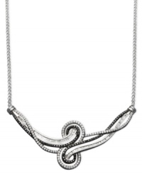 The perfect complement to your little black dress. This Wrapped in Love™ necklace defines elegance with round-cut black diamonds (1/3 ct. t.w.) and round and baguette-cut white diamonds (5/8 ct. t.w.) set in sterling silver. Approximate length: 15 inches. The perfect complement to your little black dress. This Wrapped in Love™ necklace defines elegance with round-cut black diamonds (1/3 ct. t.w.) and round and baguette-cut white diamonds (5/8 ct. t.w.) set in sterling silver. Approximate length: 15 inches.