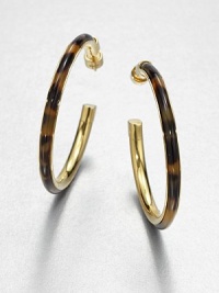 A glossy tortoise print inset hoop cradled in radiant goldtone channel. Goldtone ion-plated steelAcetateLength, about 2.5Post backImported A glossy tortoise print inset hoop cradled in radiant goldtone channel. Goldtone ion-plated steelAcetateLength, about 2.5Post backImported