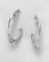 From the Bamboo Collection. Graceful double arcs of bamboo-motif sterling silver twist around one another in these elegant open hoops.Sterling silverDiameter, about 1.5Post backMade in Bali