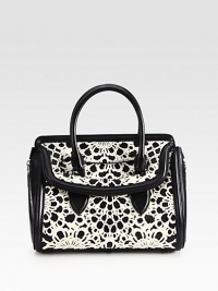 A truly unique and luxurious design featuring laser cut haircalf atop supple leather in a feminine frame.Double top handles, 3½ dropFlap closureExpandable side zippersOne inside zip pocketTwo inside open pocketsCotton lining13W X 12H X 7DMade in Italy A truly unique and luxurious design featuring laser cut haircalf atop supple leather in a feminine frame.Double top handles, 3½ dropFlap closureExpandable side zippersOne inside zip pocketTwo inside open pocketsCotton lining13W X 12H X 7DMade in Italy