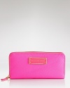 This everyday MARC BY MARC JACOBS style is anything but basic, finished with an enamel logo plate. Its zip around closure opens to a lined interior with 8 credit card pockets.