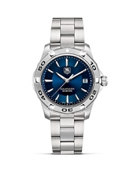 The Aquaracer series features professional diving watches with TAG Heuer's Six Features: Screw in crown, unidirectional rotating bezel, sapphire crystal, double security clasp, 300M water resistance and luminescent hands and markers. This model features blue dial and steel case and bracelet. The Aquaracer series features professional diving watches with TAG Heuer's Six Features: Screw in crown, unidirectional rotating bezel, sapphire crystal, double security clasp, 300M water resistance and luminescent hands and markers. This model features blue dial and steel case and bracelet.