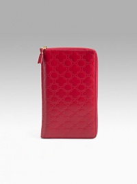 Clover-embossed leather zip-around wallet has plenty of interior sections to keep your essentials at hand. Opens to reveal 11 credit card slots, four deep pockets, ID window, pen holder and a coin pocket with snap closure. Zip-around closure Leather lining 5W X 9H X ¾D Made in Spain Clover-embossed leather zip-around wallet has plenty of interior sections to keep your essentials at hand. Opens to reveal 11 credit card slots, four deep pockets, ID window, pen holder and a coin pocket with snap closure. Zip-around closure Leather lining 5W X 9H X ¾D Made in Spain