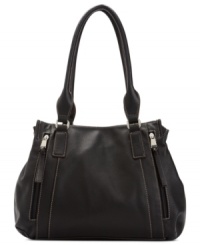 Highly functional and totally fabulous, this chic shopper from Tignanello is the ultimate daytime accessory. Soft leather is accented with shiny silvertone hardware, while the interior offers three separate compartments with plenty of pockets to keep you organized on-the-go. Highly functional and totally fabulous, this chic shopper from Tignanello is the ultimate daytime accessory. Soft leather is accented with shiny silvertone hardware, while the interior offers three separate compartments with plenty of pockets to keep you organized on-the-go.