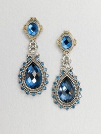 An exquisite teardrop design with beautiful faceted London blue topaz and blue topaz stones set in sterling silver and accented with 18k gold. Sterling silver18k goldBlue topazLondon blue topazDrop, about 1.75Post backImported 