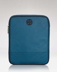 Ever-durable nylon constructs this sleek Tory Burch iPad case, detailed with the label's signature hardware. Ever-durable nylon constructs this sleek Tory Burch iPad case, detailed with the label's signature hardware.