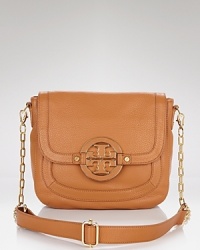 Go from day to a night downtown with Tory Burch's chain-trimmed crossbody bag. To channel the label's polished edge slip the luxe leather bag over dark denim with stacked gold jewels. Go from day to a night downtown with Tory Burch's chain-trimmed crossbody bag. To channel the label's polished edge slip the luxe leather bag over dark denim with stacked gold jewels.