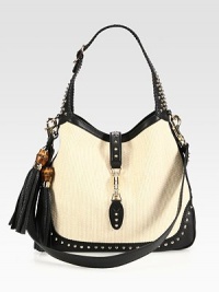 Instantly recognizable and unmistakably stylish, the contemporary flair of the New Jackie is fashion at its most vibrant. White strawBlack leather trimLight fine gold hardwareSingle adjustable strap, 8 drop Detachable shoulder strap, 18 dropPiston strap closureInterior smart phone and zip pocketsNatural cotton linen liningMedium size: 14W x 11.5H x 2DMade in Italy Instantly recognizable and unmistakably stylish, the contemporary flair of the New Jackie is fashion at its most vibrant. White strawBlack leather trimLight fine gold hardwareSingle adjustable strap, 8 drop Detachable shoulder strap, 18 dropPiston strap closureInterior smart phone and zip pocketsNatural cotton linen liningMedium size: 14W x 11.5H x 2DMade in Italy