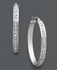 A necessary extra. Hoop earrings are the ultimate accessory, and this sparkling style is no exception. Crafted in sterling silver, hoops feature dozens of sparkling, round-cut diamond accents. Approximate diameter: 1-1/8 inches. A necessary extra. Hoop earrings are the ultimate accessory, and this sparkling style is no exception. Crafted in sterling silver, hoops feature dozens of sparkling, round-cut diamond accents. Approximate diameter: 1-1/8 inches.