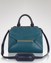 A perfectly proportioned Tory Burch satchel styled in leather lends cool-elegance to any look. An envelope pocket and suede trims detail the exterior, while a lined interior features 3 pockets. A perfectly proportioned Tory Burch satchel styled in leather lends cool-elegance to any look. An envelope pocket and suede trims detail the exterior, while a lined interior features 3 pockets.