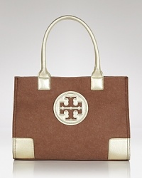 Tory Burch's signature tote is sized down for the smaller-scale daytime demands, updated in felt with leather trims. Tory Burch's signature tote is sized down for the smaller-scale daytime demands, updated in felt with leather trims.