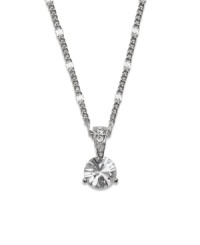 Capture a look of sparkle and simplicity. This elegant necklace by Swarovski is perfect for any occasion with its round-cut solitaire crystal design accented by a crystal-coated bail. Setting and chain crafted in silver tone mixed metal. Approximate length: 18 inches. Approximate drop: 3/4 inch. Capture a look of sparkle and simplicity. This elegant necklace by Swarovski is perfect for any occasion with its round-cut solitaire crystal design accented by a crystal-coated bail. Setting and chain crafted in silver tone mixed metal. Approximate length: 18 inches. Approximate drop: 3/4 inch.