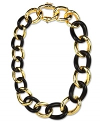 Black and gold for the fashionably bold. This Anne Klein necklace features interlocking links in gold tone mixed metal and plastic jet stone. Approximate length: 18-inches + 2-inch extender. Black and gold for the fashionably bold. This Anne Klein necklace features interlocking links in gold tone mixed metal and plastic jet stone. Approximate length: 18-inches + 2-inch extender.