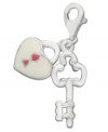 The key to happiness is through the heart. These delicate charms will add the finishing touch to any necklace or bracelet. Crafted in sterling silver with cubic zirconia accents, charm features a key with a pink and white heart-shaped lock. Lobster claw clasp. Approximate drop: 1-1/5 inches.