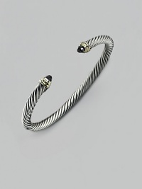 From the Cable Classic Collection. A signature Yurman cable of sterling silver, richly crowned in 14K yellow gold with black onyx end caps. Sterling silver and 14k yellow gold Black onyx Cable, 5mm Diameter, about 2½ Imported From the Cable Classic Collection. A signature Yurman cable of sterling silver, richly crowned in 14K yellow gold with black onyx end caps. Sterling silver and 14k yellow gold Black onyx Cable, 5mm Diameter, about 2½ Imported