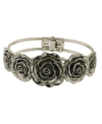 Highlight your unique sense of style in beautiful blossoms. 2028's fresh floral cuff features intricate flowers with jet enamel accents. Crafted in silver tone mixed metal. Approximate diameter: 2-1/5 inches. Highlight your unique sense of style in beautiful blossoms. 2028's fresh floral cuff features intricate flowers with jet enamel accents. Crafted in silver tone mixed metal. Approximate diameter: 2-1/5 inches.