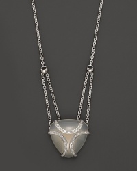 A bold sterling silver cage, glistening with diamonds, encases a gleaming white onyx stone. By Di MODOLO. A bold sterling silver cage, glistening with diamonds, encases a gleaming white onyx stone. By Di MODOLO.