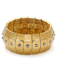 Chunky and classic. This Carolee bangle styles your look with gilt glamor, cast in gold tone plate with inset stone accents. Chunky and classic. This Carolee bangle styles your look with gilt glamor, cast in gold tone plate with inset stone accents.